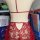 Red lace bodysuit for women, featuring a sheer transparent design with floral patterns and a seductive open back.