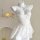 White lace cami nightgown with sheer mesh, floral trim, and pearl straps on mannequin.