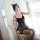Woman wearing black lace cat maid corset set with sheer mesh dress, underwire push-up bodysuit and detachable straps.