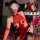 Woman modeling red lace cut-out cheongsam lingerie with sheer panels, thigh-highs, and arm sleeves; provocative sleepwear des...
