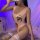 Sexy lace lingerie set featuring a cartoon face design, paired with sheer stockings and matching chemise, perfect for seducti...