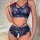 Sexy lace lingerie set featuring sheer transparent design with intricate floral patterns, delicate straps, and cut-out detail...