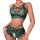 Woman modeling a sexy green lace lingerie set with sheer panels, cut-out details, and matching sleepwear.