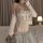 Woman wearing a sexy lace lingerie set with sheer push-up bodysuit and seductive uniform style sleepwear for small bust.