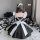 Sexy lace maid costume with cut-out details and adjustable straps, featuring a seductive apron design for adults.