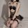 Sexy lace maid costume featuring sheer mesh pettiskirt, black bodice with crisscross detailing, and fishnet stockings, perfec...