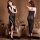 Woman modeling black sheer mesh nightgown with side slit and crisscross back straps, paired with high heels.