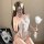 Woman in white lace open-crotch bodysuit with blue floral embroidery, holding feather wand — sexy qqny-style sleepwear for sm...