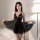 Woman modeling black lace peek-a-boo sleep dress with sheer overlay and open-crotch design, plus size lingerie.
