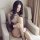 Woman wearing a sexy lace see-through lingerie set with an open-crotch bodysuit featuring a butt-lifting design, sitting eleg...