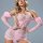 Woman modeling pink lace see-through lingerie set with embroidered details and off-shoulder sleeves.