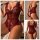 Woman wearing red and black lace sheer bodysuit with floral embroidery, deep v-neck, adjustable straps, and open back design.