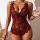 Woman wearing red and black lace sheer bodysuit with floral embroidery, bow straps, and mesh detailing. elegant european-styl...