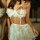 Woman wearing white lace chemise set with sheer push-up bra and matching thong, elegant transparent lingerie for romantic occ...