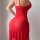 Woman wearing red lace sheer lounge set with mesh bodysuit and pencil skirt, -style home outfit.