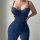 Woman wearing navy lace bodysuit and ruched pencil skirt from sexy lace sheer lounge set – -style mesh home outfit.