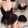 Woman wearing black lace sheer sleep dress with delicate detailing and flirty design, perfect for sweet and alluring loungewe...