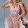 Woman wearing a pink lace sheer sleep set with transparent straps, featuring a mesh nightgown and lingerie pajama set.