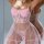 Woman wearing pink lace sheer sleep set with transparent straps, mesh lingerie nightgown and ruffled hem.