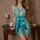 Woman wearing turquoise lace nightgown with cutout and bow, elegant backless design, sheer mesh lingerie.