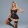 Woman modeling black lace sleep dress with sheer back, high slit, and garter belt – premium erotic lingerie set.
