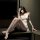 A woman poses elegantly in a sheer lace sleep dress set, featuring delicate cut-out details and soft fabric, perfect for a ni...