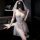 Woman in white lace bridal lingerie set with sheer skirt, pearl belt, and veil—sexy sleep dress for intimate moments.