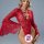 Woman wearing red lace sleepwear set with flared sleeves, playful and alluring intimate apparel for couples.