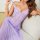 Woman wearing purple lace sleepwear set with sheer mesh camisole and matching briefs, elegant lounge lingerie.