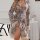 Woman wearing floral lace robe with ties, fringe hem, and open back—sexy sleepwear set for small bust enhancement.