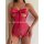 Woman wearing a hot pink lace teddy bodysuit with a large bow detail at the bust and sheer floral pattern.