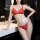Woman wearing red lace bikini set in bathroom – sheer mesh lingerie with elegant floral trim, premium seductive design.