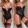 Woman modeling black lace transparent bodysuit with garter straps and matching thigh-high stockings, elegant -style sleepwea...