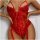 Woman wearing a red lace transparent bodysuit with satin trim and garter straps.