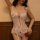 Woman wearing a sexy lace transparent sleepwear set featuring a seductive babydoll top with short skirt bodysuit design.