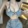 Woman wearing sexy lace-trimmed denim short set, featuring a seductive no-remove design perfect for bedroom wear.