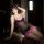 Woman wearing sexy lace underwire bodycon skirt set - pure temptation office uniform outfit for women, posing elegantly on a ...
