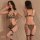 Sexy leopard print bodysuit set with matching thong and garter straps, shown front and back on model in sheer curtains.