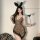 Woman wearing sexy leopard print lingerie set with bunny ears and heart wand, perfect for role play and date night.