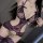 Sheer purple lace bodysuit with open-crotch design, floral mesh detailing, and adjustable straps for a sultry, bodycon fit.
