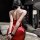 Sexy red lace tie-up dress with revealing back design, perfect for night out or flirtatious occasions.