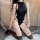 Sexy black bodysuit with open-crotch design, sheer stockings, elegant pose on fluffy rug, perfect for seductive costume sleep...