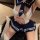 Woman wearing sexy open-crotch backless school uniform lingerie set for role play and adult fun.