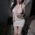 Woman in white deep v-neck mini dress with sheer stockings, posing seductively on fluffy rug — sexy lingerie set for women: p...