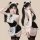 Woman modeling sexy maid costume lingerie set with cat ears, lace trim, and thigh-high stockings for role play.