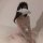 Woman wearing sexy maid costume with lace sheer corset, ties, and bow—role play lingerie outfit for women.