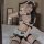 Woman in sexy maid costume set with qipao-inspired bikini top, split skirt, and sailor sleepwear details.