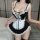 Sexy maid costume for women featuring a black and white design with lace details, adjustable straps, and a seductive look, pe...
