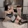 Sexy maid costume for women featuring a short skirt, lace details, and stockings, perfect for a seductive student style look.