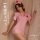 Woman wearing pink nurse costume lingerie set with red cross details, featuring seductive lace and open-crotch design for pas...